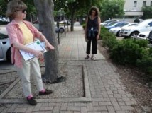 Molly MacRae and Evelyn Shapiro discuss the width and the  pavement quality of the sidewalk along Park Avenue.  