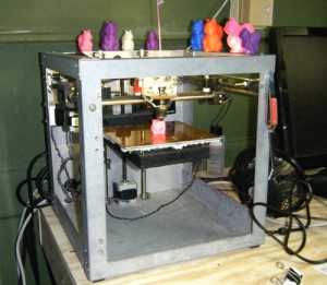 A 3D printer prints a colorful figurine at Makerspace Urbana. 