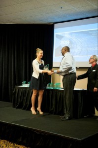 Neighborhood Services Advisory Board Member Charlotte Miles  presenting an award 
