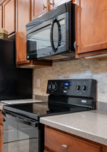 Picture of a stove and microwave in a kitchen