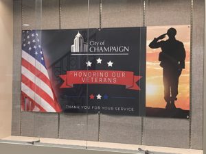 Veterans Day banner in City Building atrium display