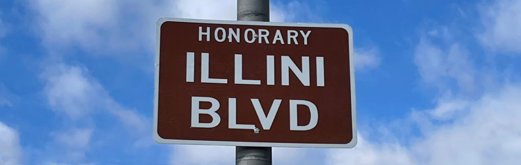 Photo of street sign for Honorary Illini Blvd.