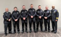 Champaign police officers that graduated from Police Training Institute and Chief Tyler.