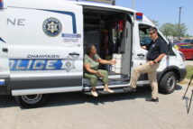 Police officer & citizen by the Crime Scene Unit Touch-a-truck