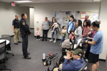 Two members of the Police Dept talking to the attendees